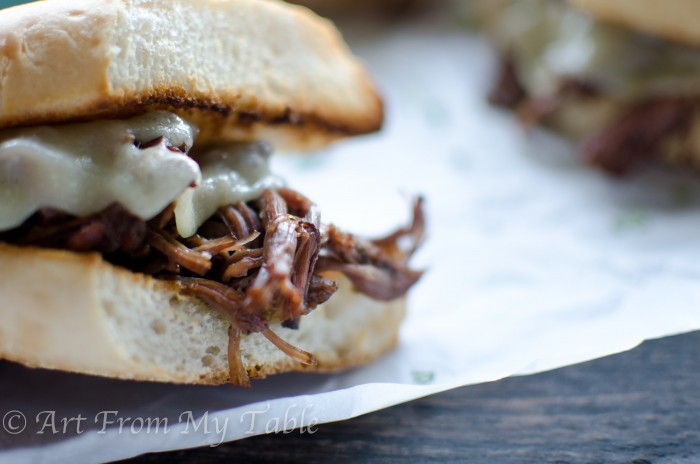 French dip sandwich with melted cheese.