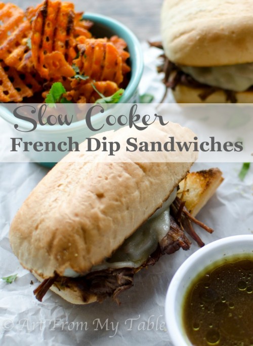 Slow cooker french dip sandwiches served with sweet potato fries and au jus for dipping.