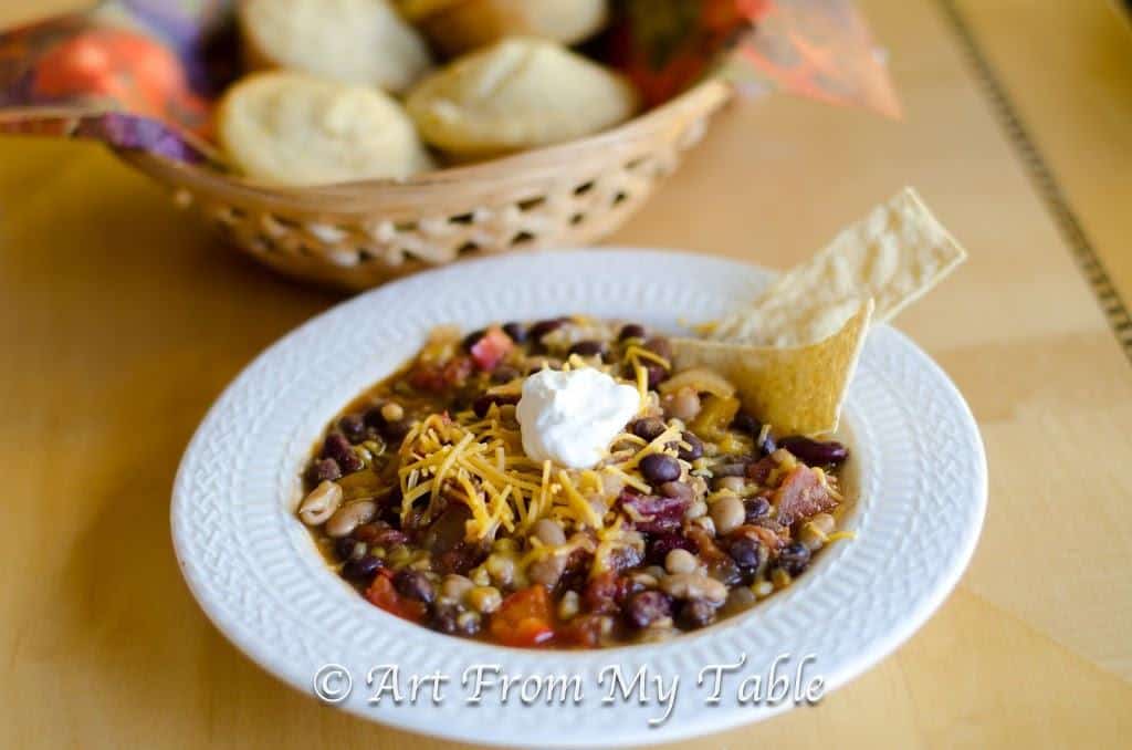 All bean chili with shredded cheese and sour cream. 