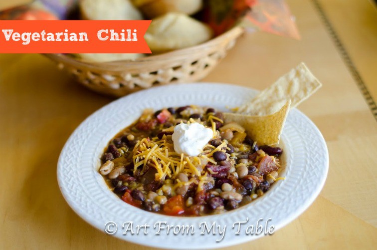 Vegetarian Chili topped with cheese and sour cream. 