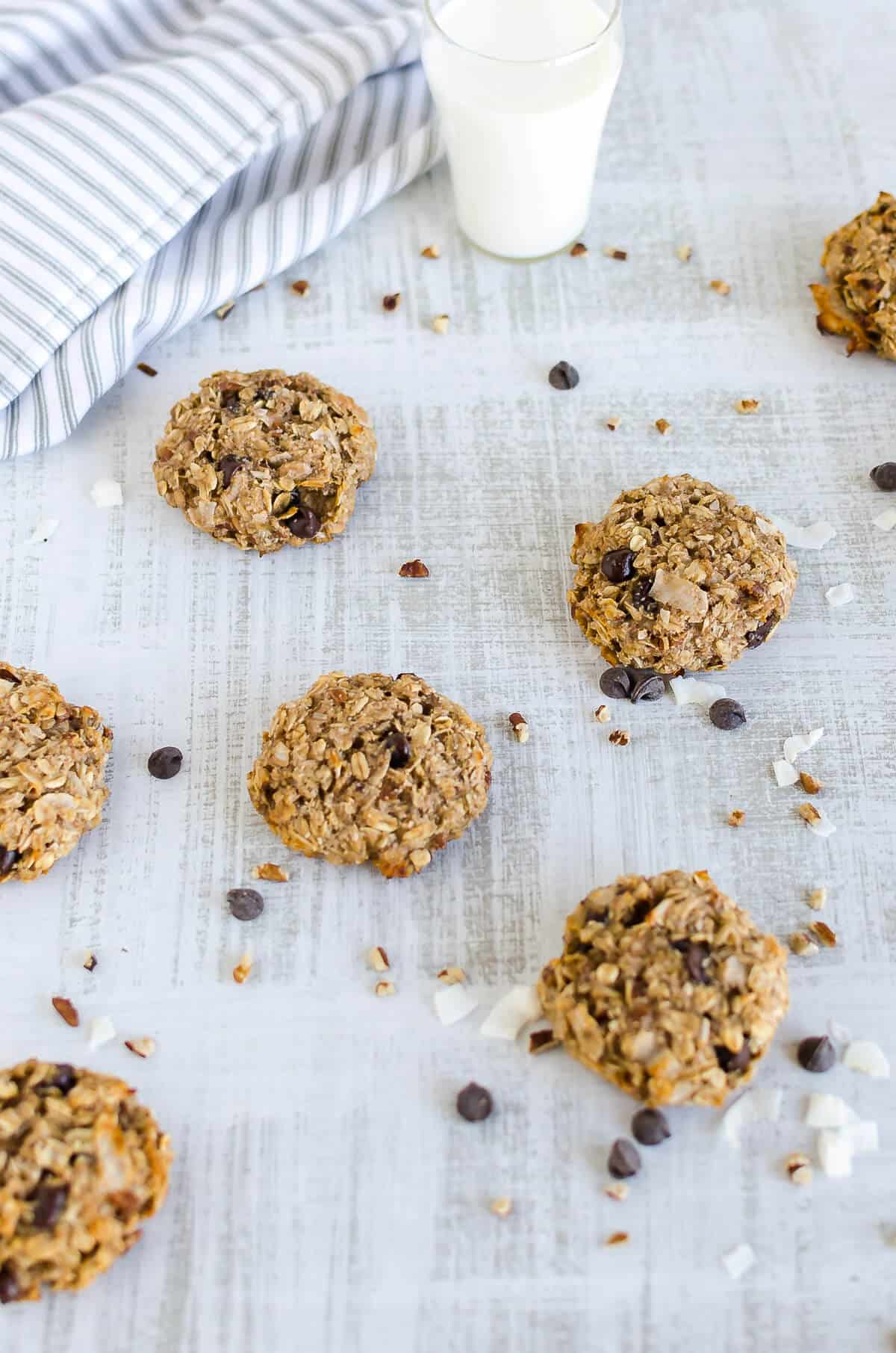 breakfast cookies laid out with oatmeal, chocolate chips, and coconut chips