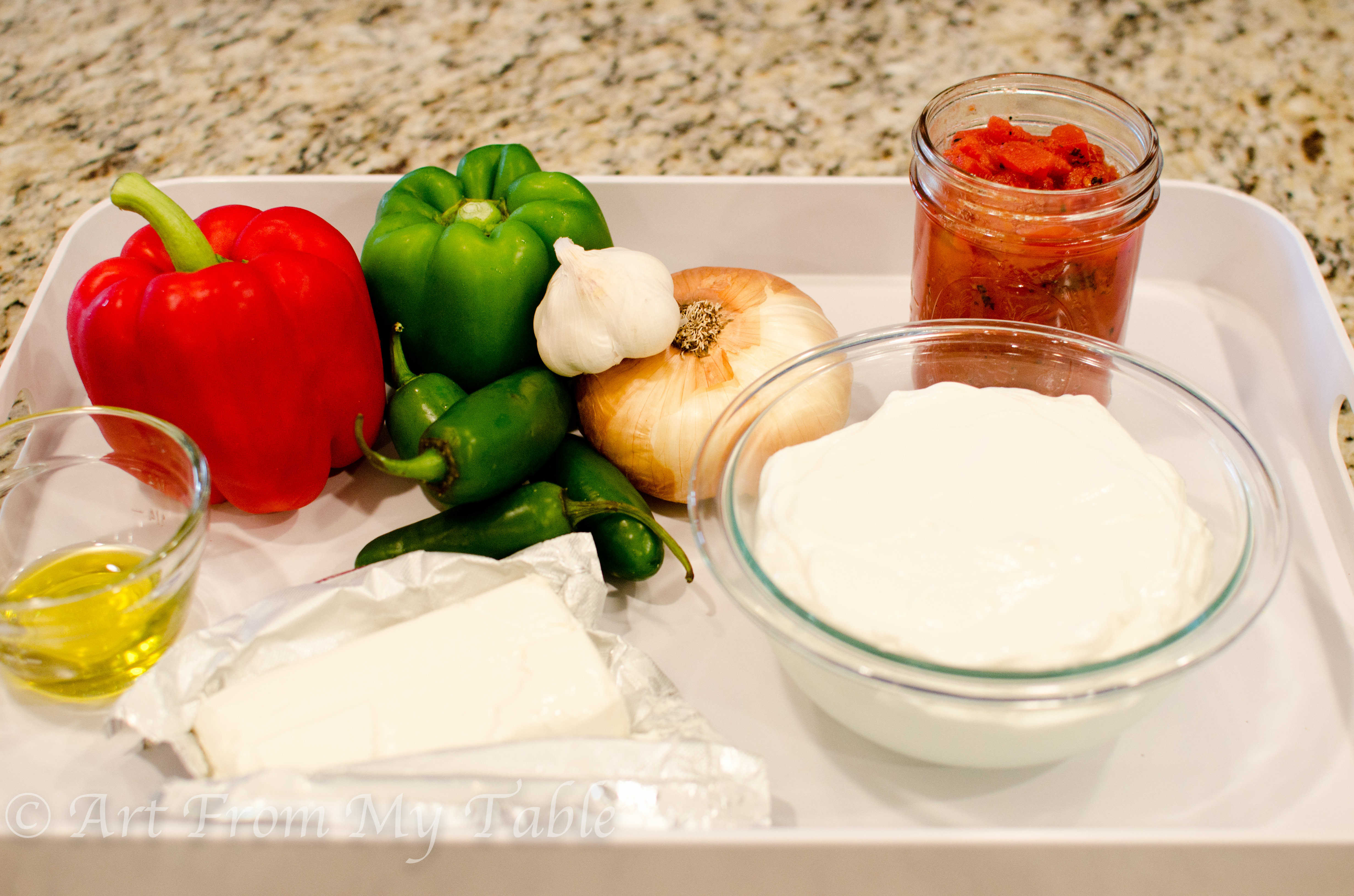 Ingredients for jalapeno yogurt dip: yogurt, vegetables, cream cheese, oil and tomatoes.