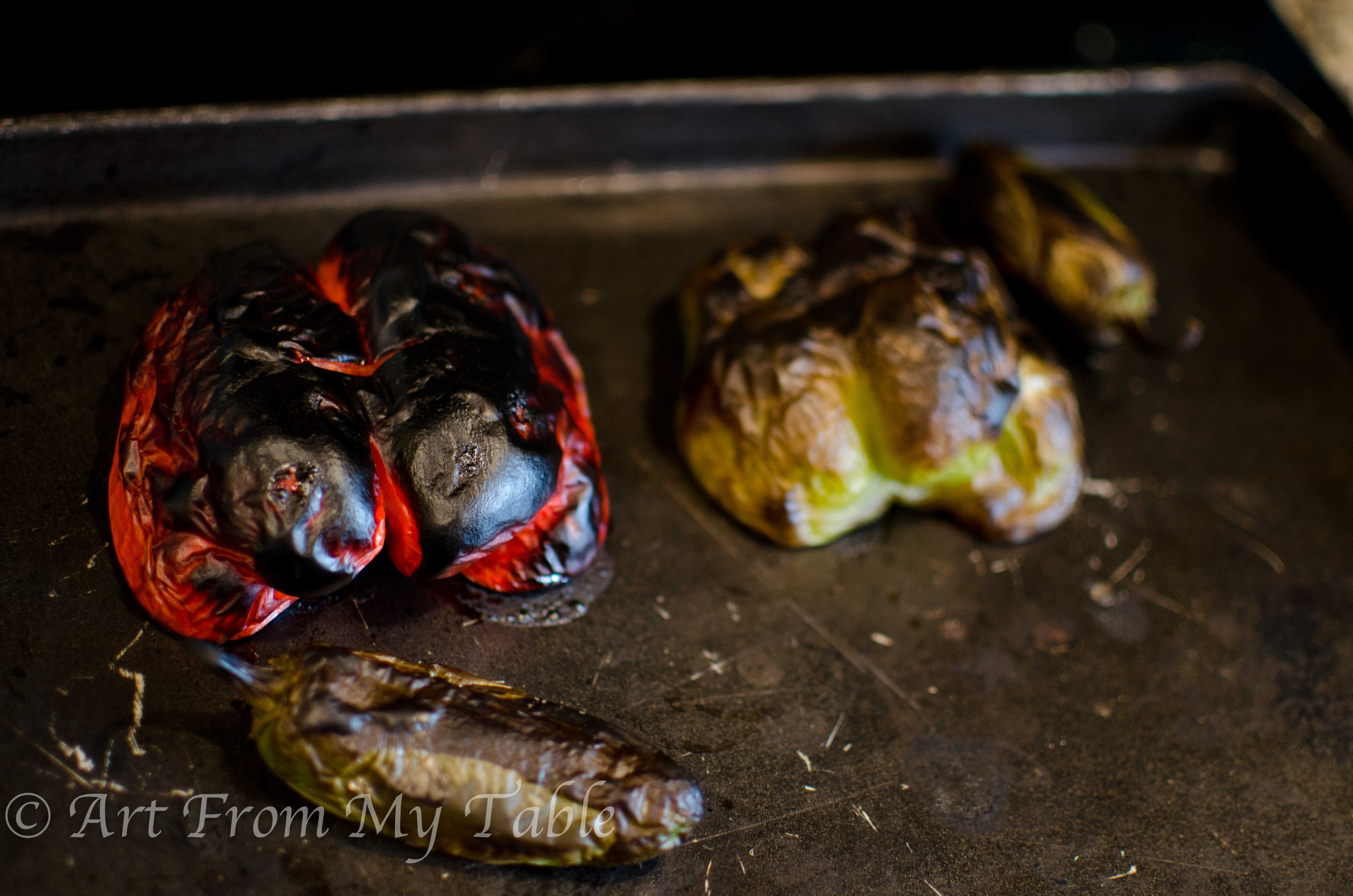 bell peppers and jalapeños charred completely from the broiler.