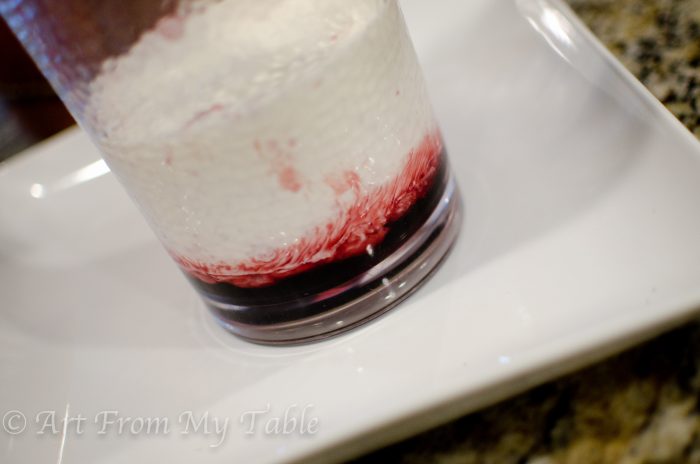 Pitcher of pomegranate juice and heavy cream, not blended.