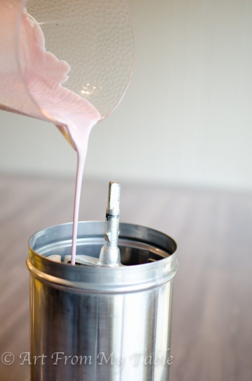Ice cream mixture being poured into an ice cream maker container.