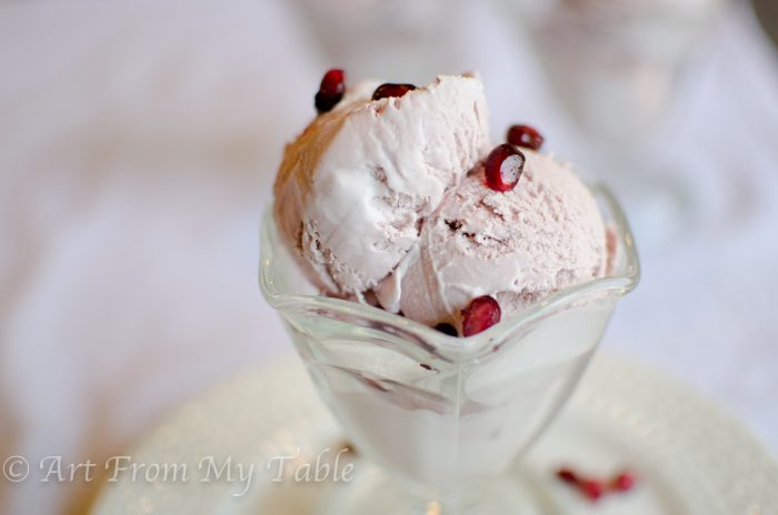 Pomegranate ice cream in a dish.