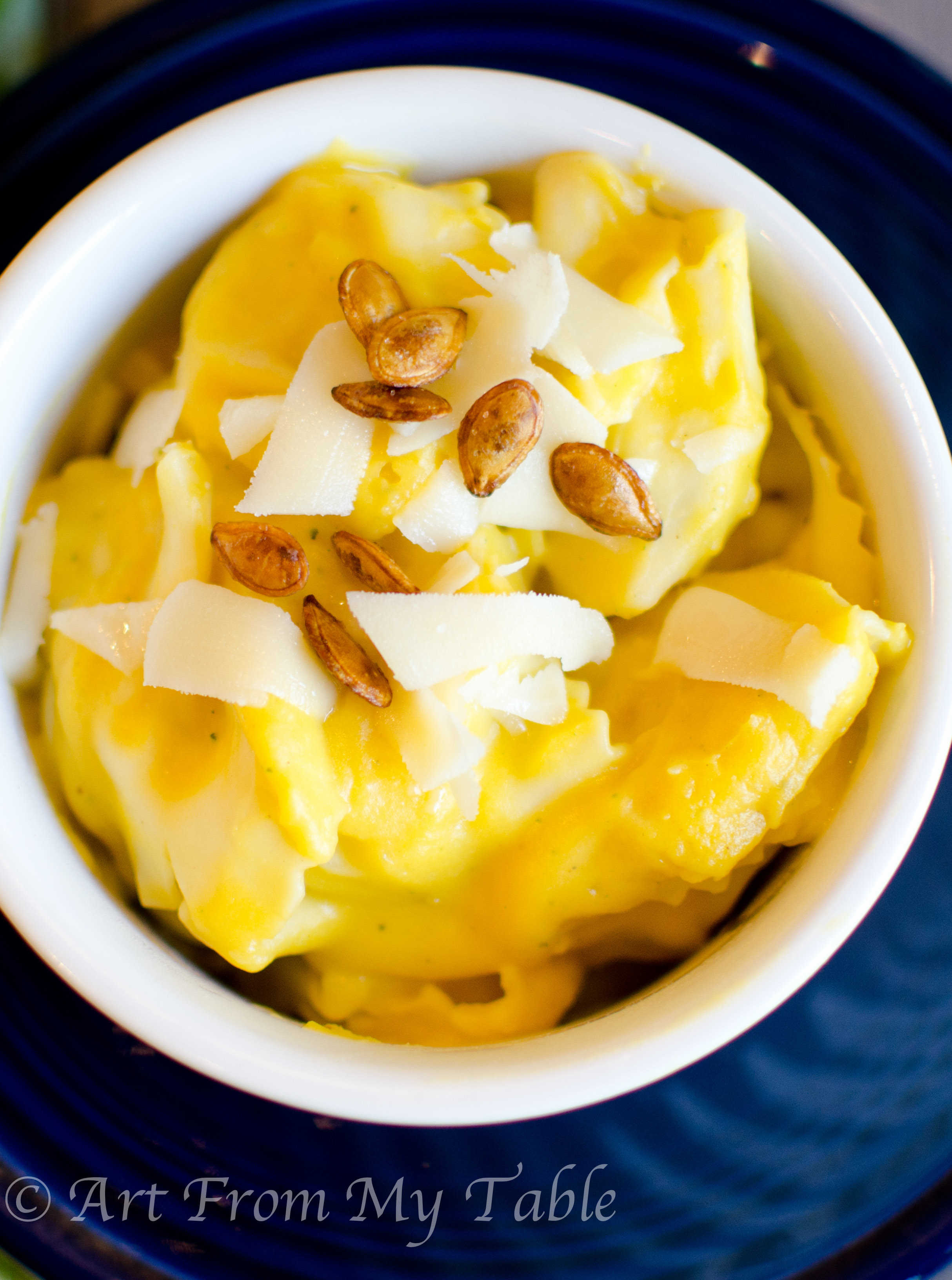 Cheese tortellini with butternut squash sauce, parmesan cheese and roasted squash seeds.