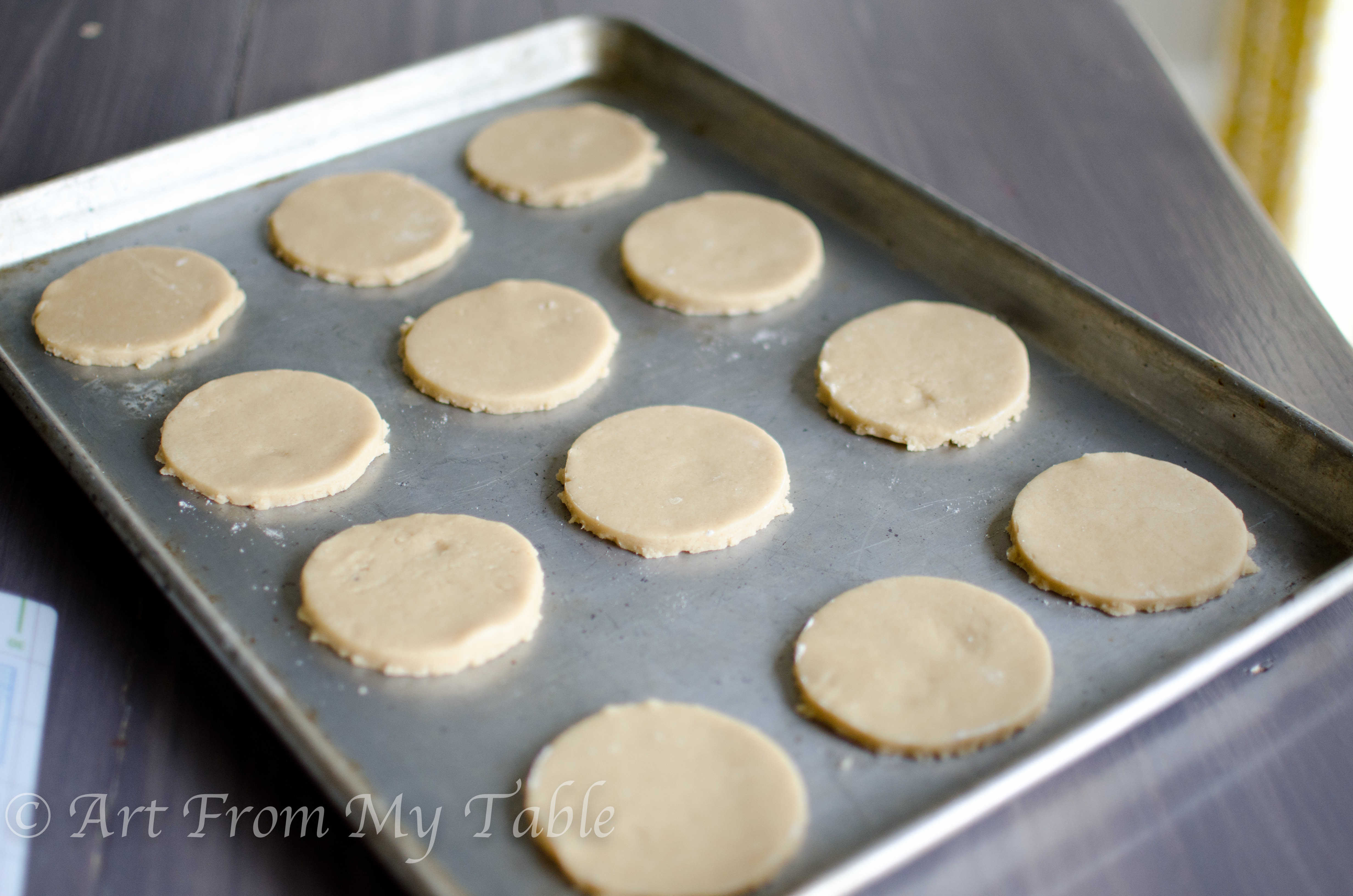 Cookie sheet with Coconut sugar cookies on it prior to baking. 