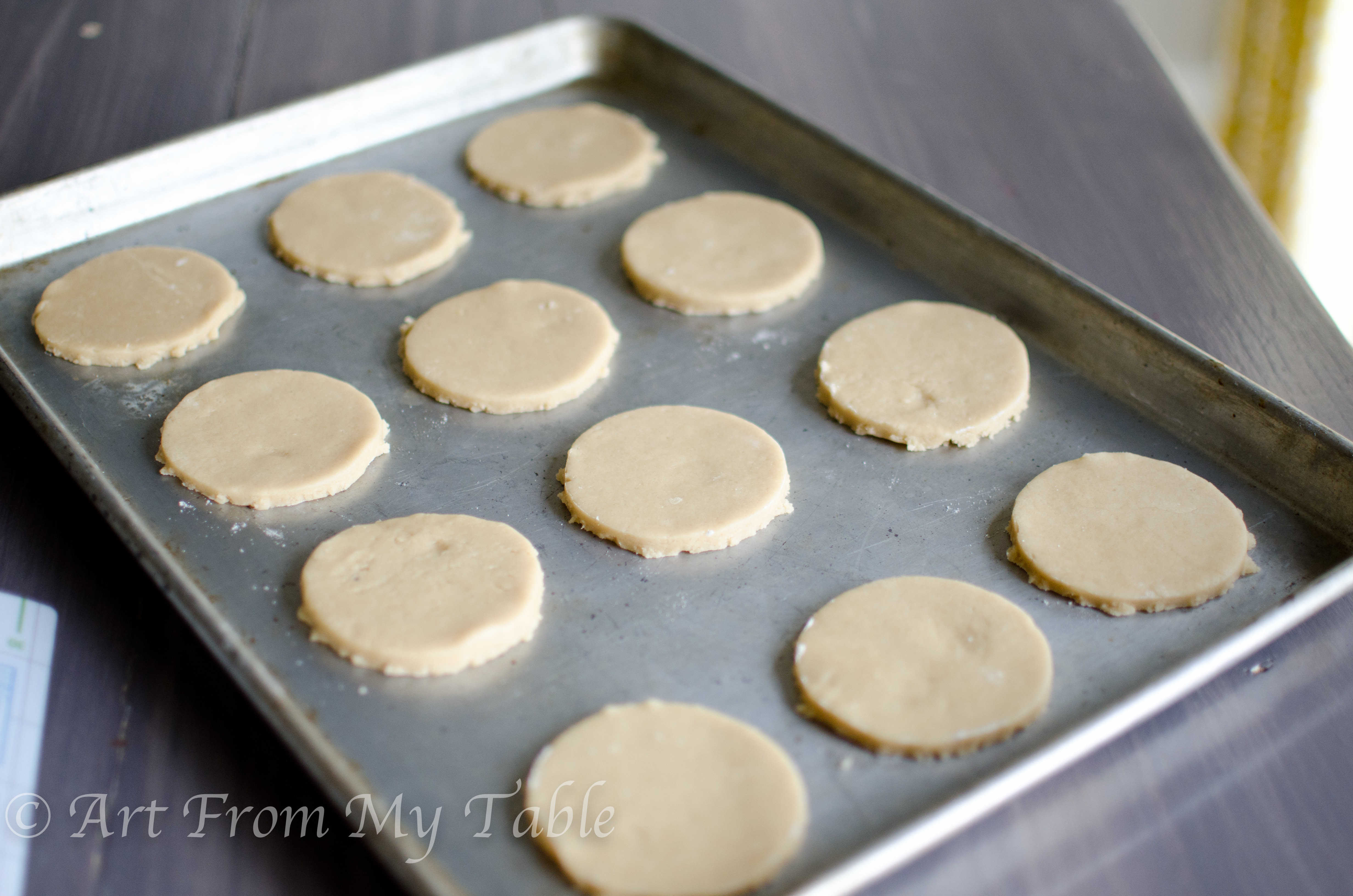 Cookie sheet with Coconut sugar cookies on it prior to baking.