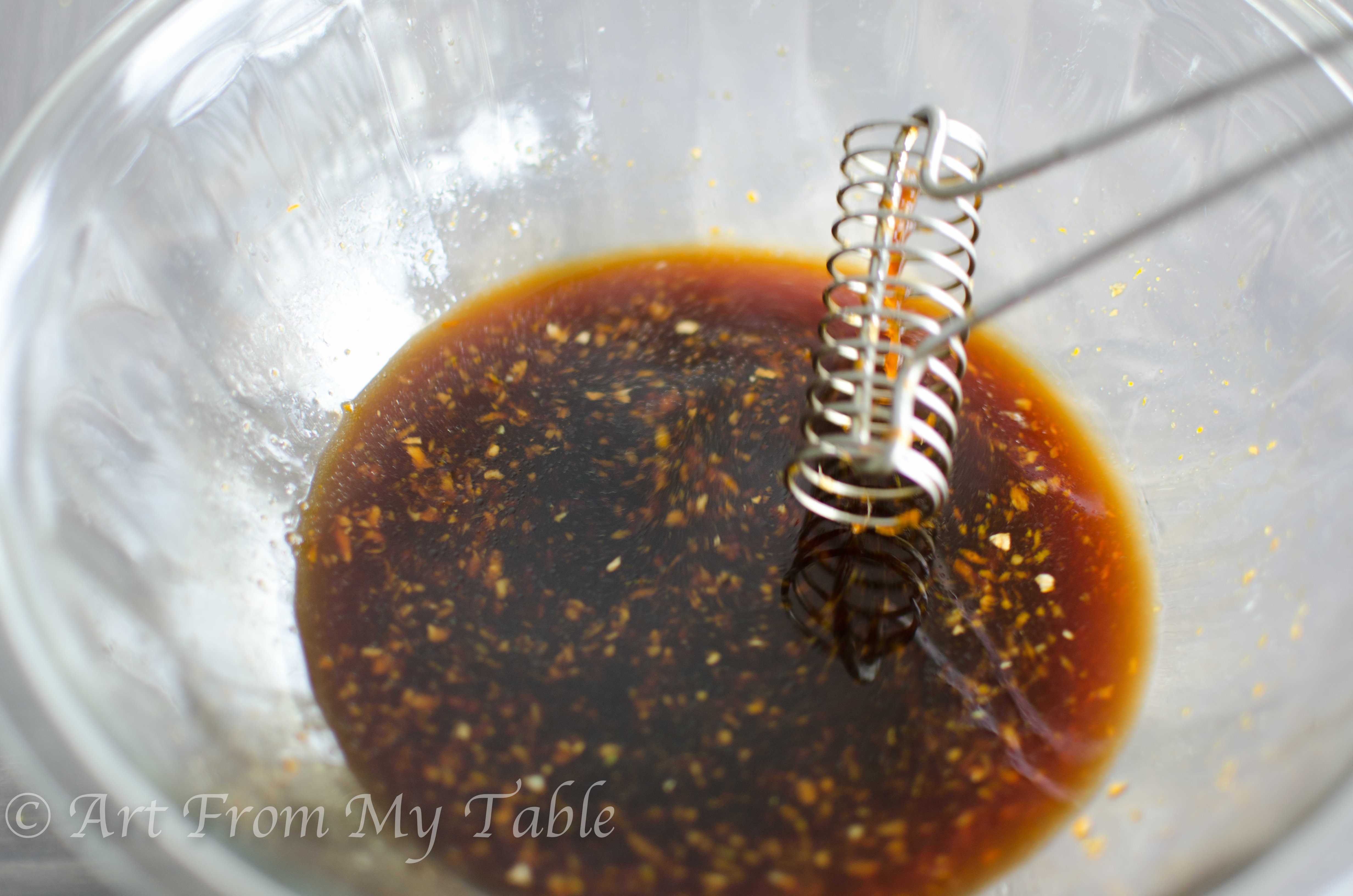 Sauce for beef with pea pods in a bowl.