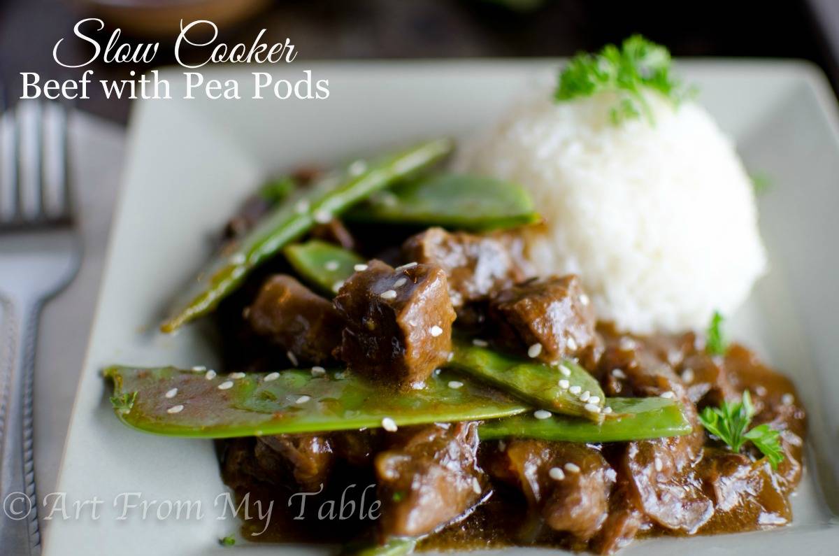 Plate of Slow cooker beef with pea pods. 