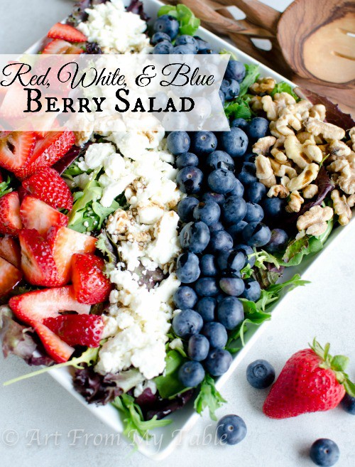 Spring Mix salad with strawberries, feta cheese, blueberries and walnuts to make a festive red white and blue salad.