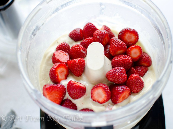 Fresh strawberries in a food processor with frozen puree'd bananas. 