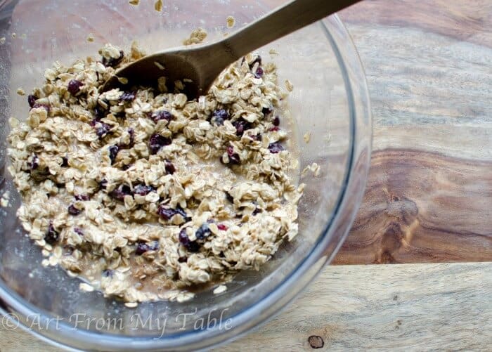Ingredients for Baked Oatmeal being mixed in a bowl.