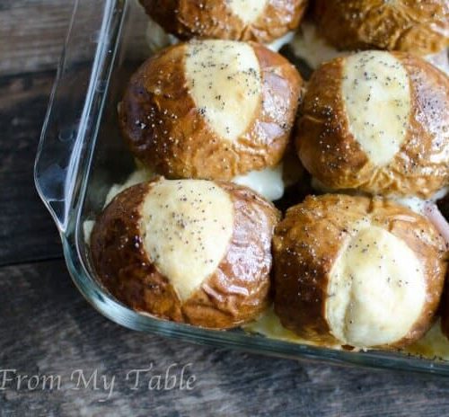 pan of baked ham and cheese soft pretzel sliders