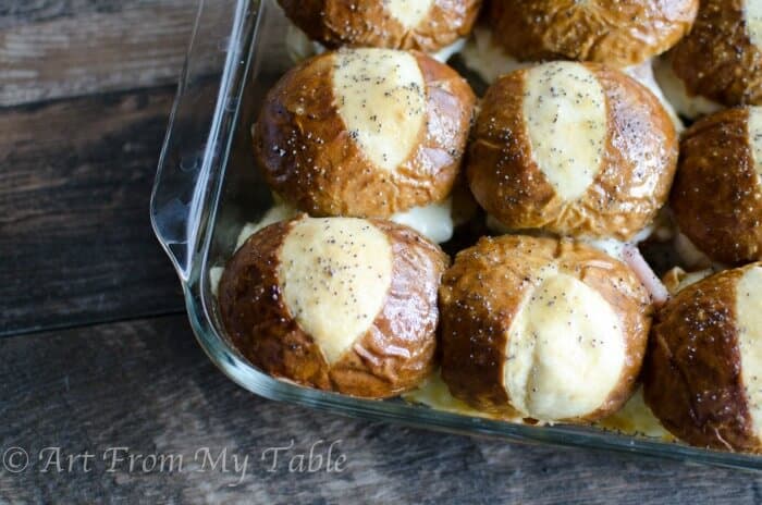 pan of baked ham and cheese soft pretzel sliders