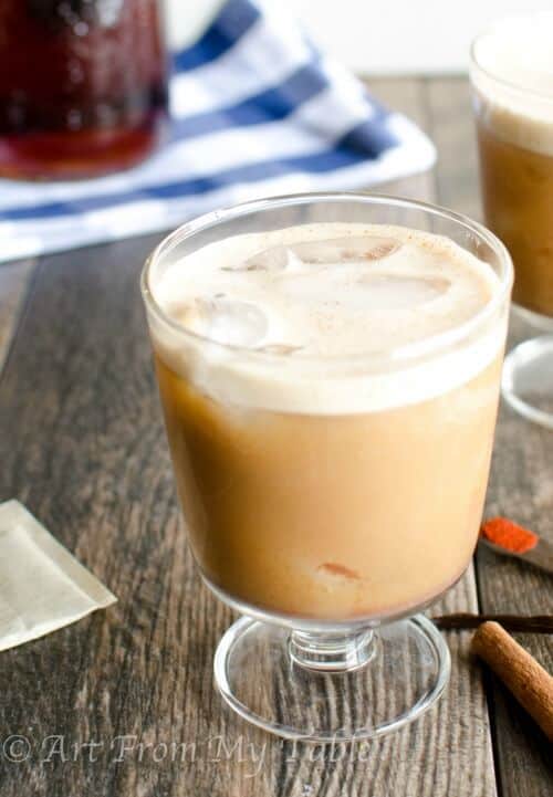 Creamy iced tea with cinnamon, vanilla and cayenne pepper a little kick in a glass.