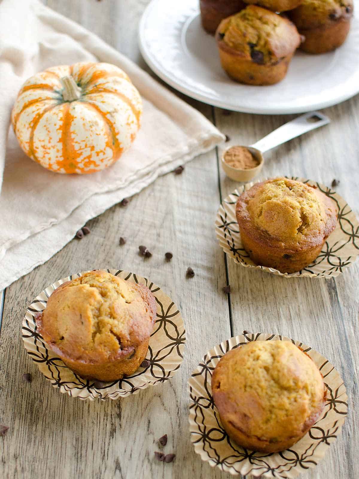 Need an easy pumpkin recipe? These are the best pumpkin muffins ever!! The addition of chocolate chips is the perfect combo! Healthy options included. #artfrommytable #pumpkin #muffins #pumpkinrecipe #fallfood #lightermuffins #pumpkinmuffins #healthypumpkinmuffins #pumpkinchocolatechip #fallrecipe via @artfrommytable