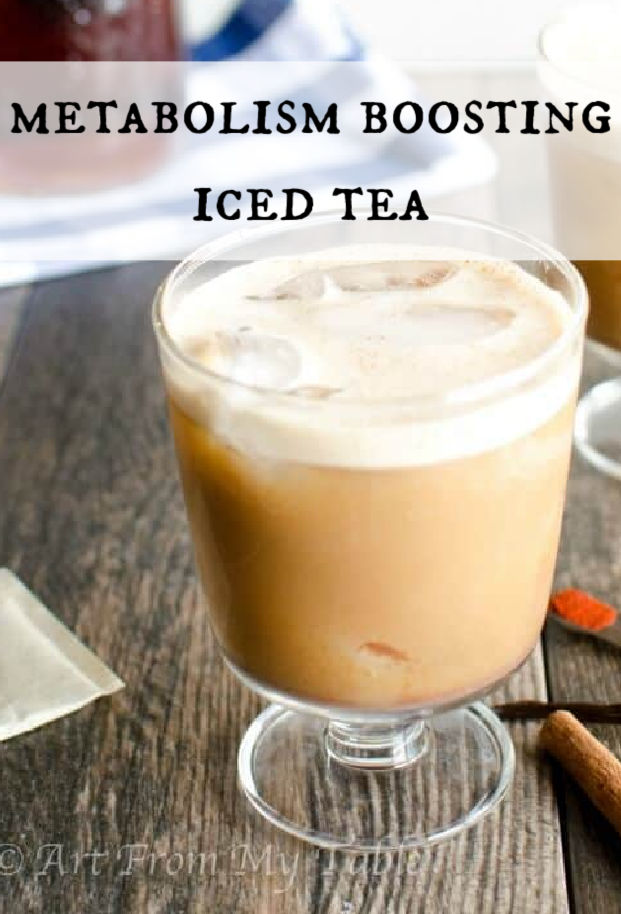 glass of metabolism boosting iced tea. Creamy light brown tea with a white froth on top in a pedestal glass via @artfrommytable