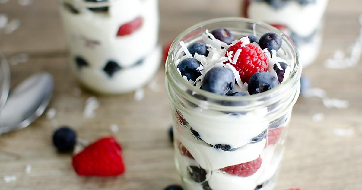 red, white and blue parfait in honor of presidents day. coconut yogurt, layered with blueberries and raspberries.