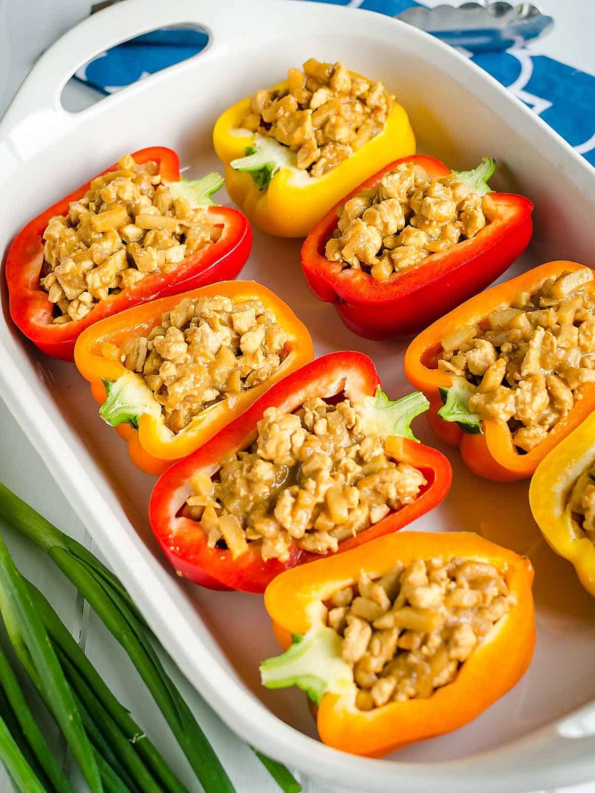 Asian chicken stuffed bell peppers ready to go in the oven.