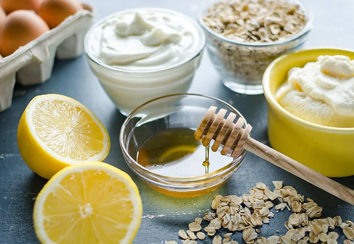 ingredients for lemon ricotta pancakes: oatmeal, yogurt, ricotta cheese, eggs, honey and lemon.
