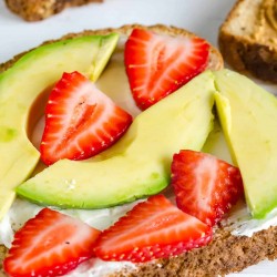 Strawberry Avocado Toast, whole grain toast, cream cheese, sliced avocado and sliced strawberries