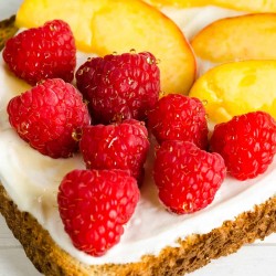 Raspberry Peach Breakfast Toast, whole grain bred, yogurt, honey, fresh raspberries, fresh peach slices