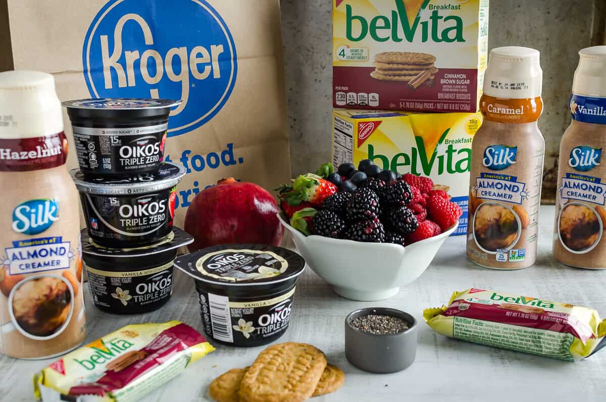 groceries from Kroger to make greek yogurt chia pudding. Oikos Greek yogurt, Pomegranate, Fresh berries, belVita breakfast biscuits, chia seeds