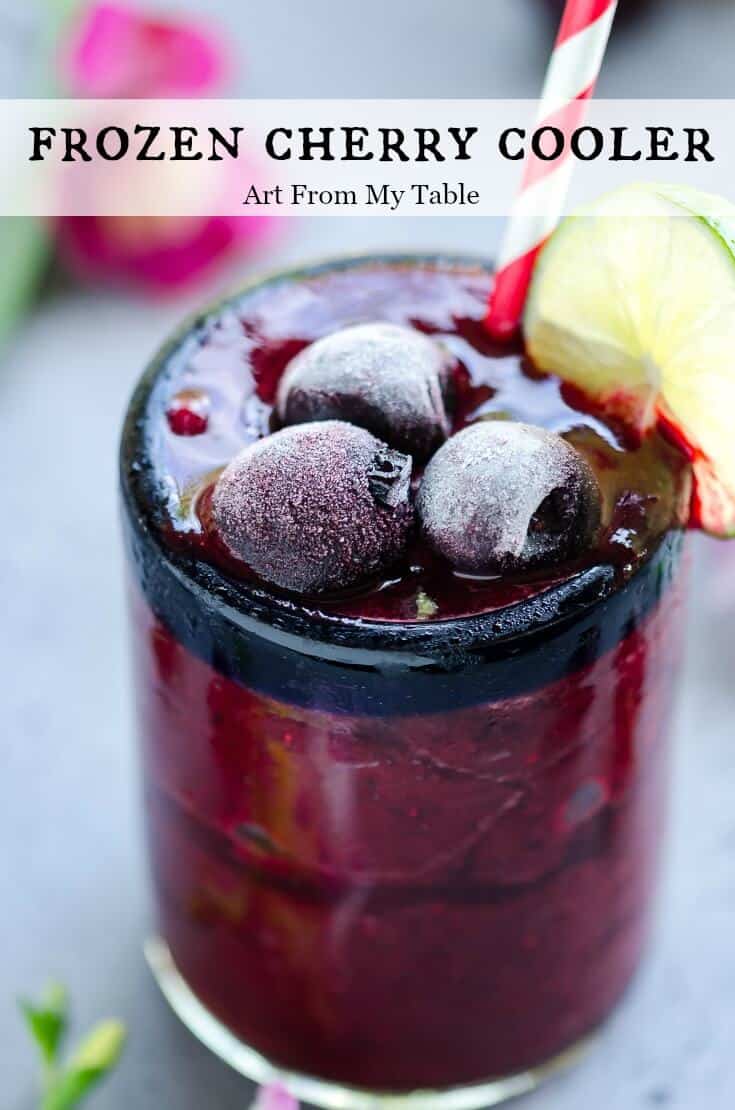 Sweet, frozen, refreshing. A cherry cooler is exactly what you need to be sipping on! This frozen blended beverage is made with sweet cherries and a hint of lime. It's the perfect way to cool down in the summer heat. #beverages #frozendrinks #summer #Cherries #beattheheat via @artfrommytable