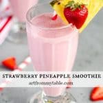 Tall glass full of Strawberry Pineapple Smoothie with hidden veggies.