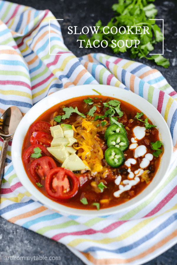 This Slow Cooker Taco Soup is so easy to throw together! It's full of flavor, using all natural ingredients. Get ready to dump and go, then come home to perfect comforting soup! Instructions on cooking in the Instant Pot are included. Let's get cooking! #artfrommytable #tacos #tacosoup #tacotuesday #slowcooker #instantpot #dumpandgo #realfood via @artfrommytable
