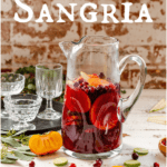 pitcher filled with non alcoholic sangria mocktail and fresh fruit