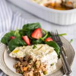 plate with helping of cottage pie made with ground turkey and cauli mash, with a side salad