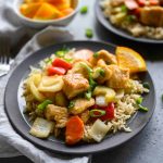 Crockpot orange chicken over rice on a plate