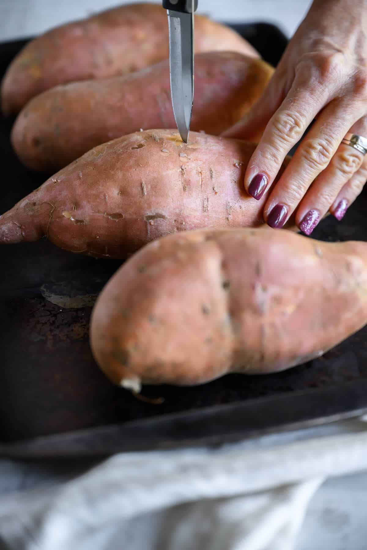 Spice up your sweet potatoes with a little southwestern flare. These stuffed sweet potatoes are loaded with chicken, peppers, and black beans in a yummy enchilada sauce. They're delicious, simple to make and healthy all at the same time.