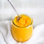 fresh pumpkin puree in a jar with a spoon sticking out