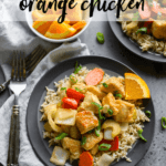 slow cooker orange chicken on top of brown rice