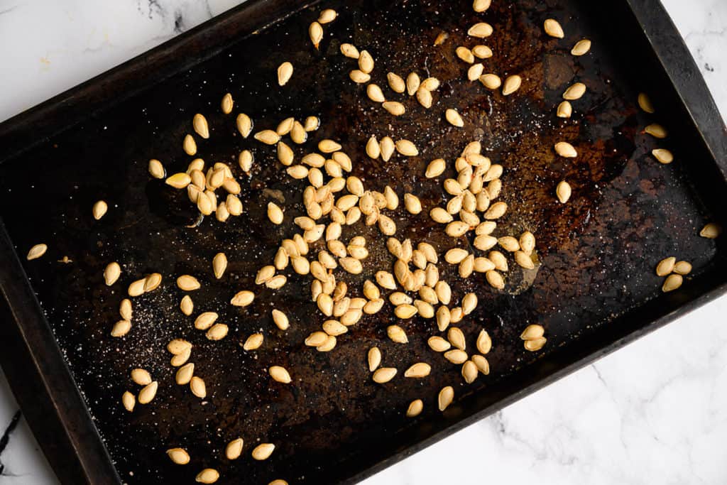 squash seeds on a baking pan