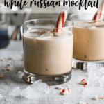 two white russian mocktails with peppermint stick garnish