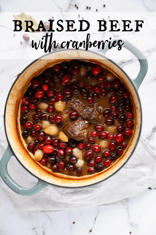 This juicy braised beef recipe is so tender and flavorful! The gravy is infused with red wine, molasses, cranberries, and onions. It's perfect for cold nights or holiday entertaining. The best news, it's super easy to do! #artfrommytable #beef #braisedbeef #christmas #cranberries #easydinneridea #onepotdinner via @artfrommytable