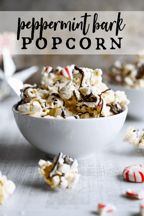Peppermint Bark Popcorn is an irresistible holiday treat that's quick and easy to make! Crunchy popcorn meets dark and white chocolate and crushed peppermint in this crowd-pleasing snack. #holidaytreats #popcorn #peppermintbark via @artfrommytable