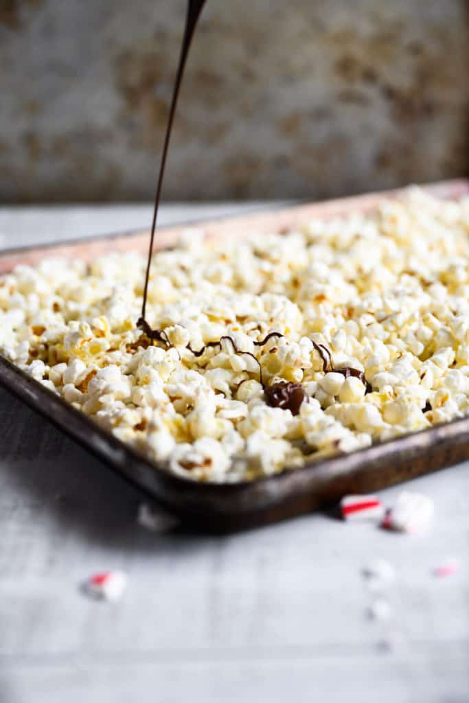 chocolate being drizzled over popcorn