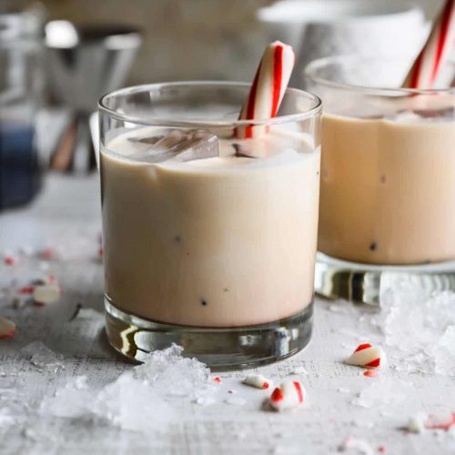 non alcoholic peppermint white russian garnished with peppermint stick
