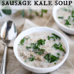 two bowls of sausage kale soup garnished with pepper