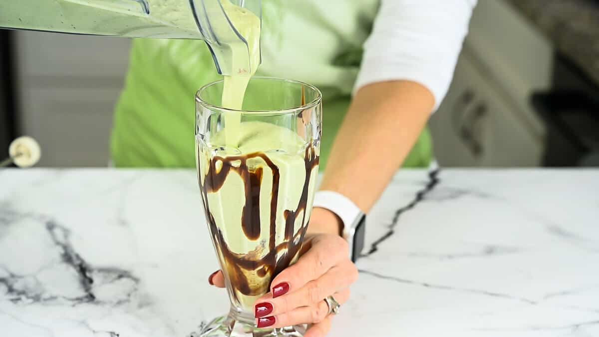 shamrock shake being poured into a glass