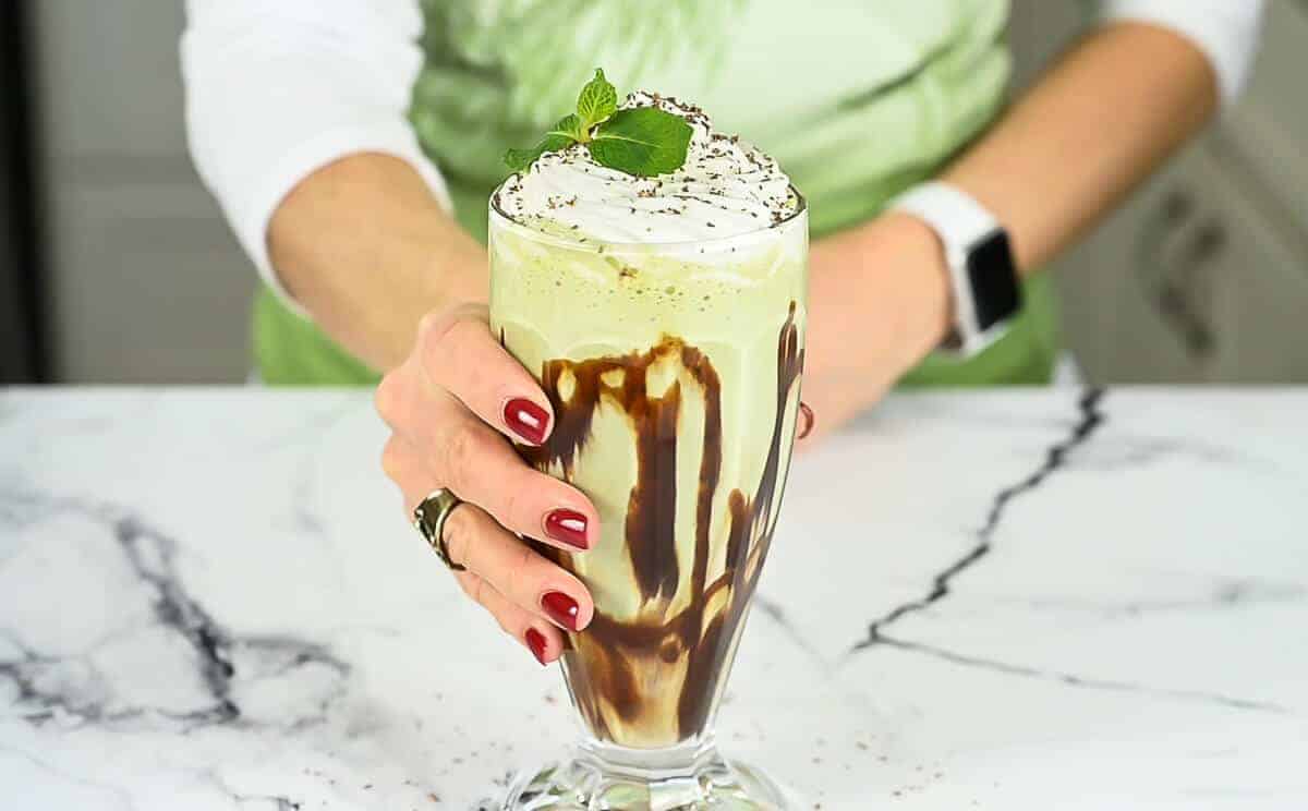 hand holding a shamrock shake