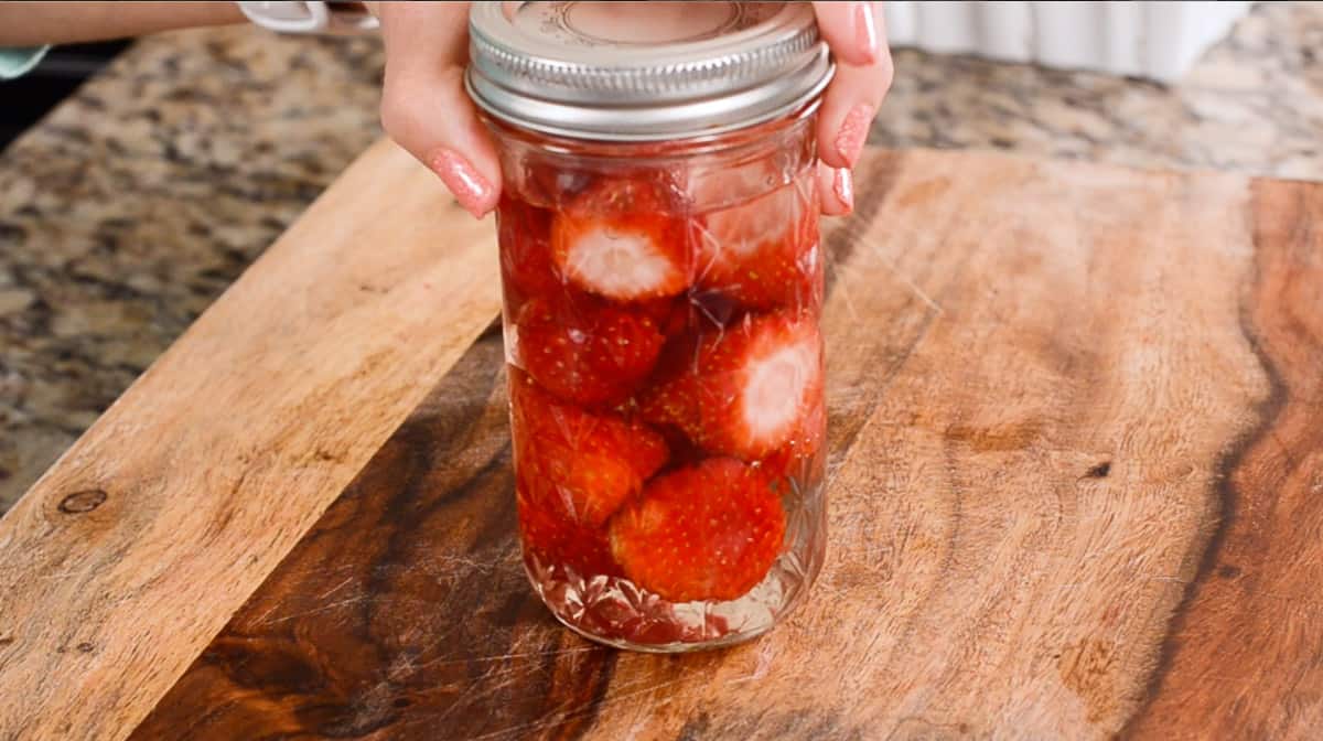 jar fresh strawberries in simple syrup