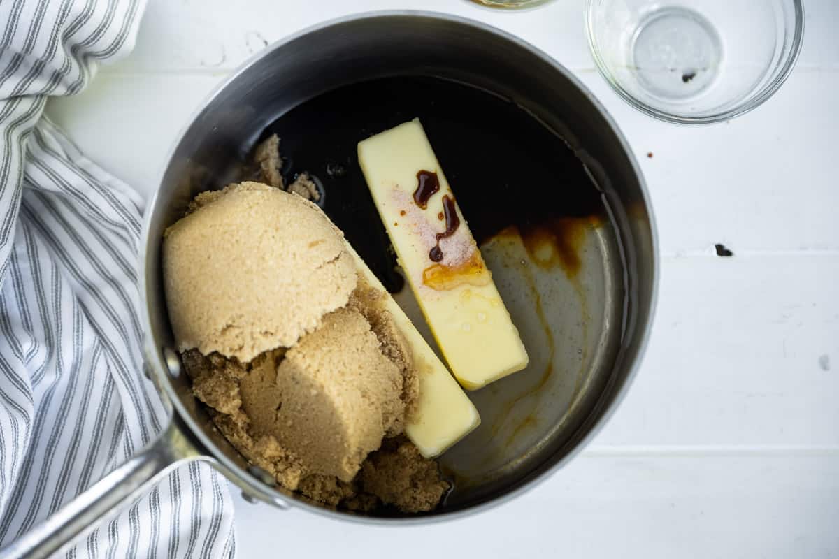 butter, brown sugar, molasses and corn syrup in a saucepan