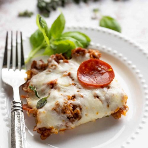 slice of pizza casserole on a white plate